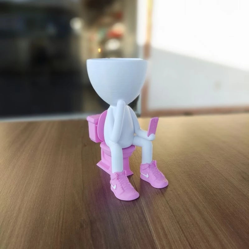 Vaso Decorativo Robert Plant no Banheiro com celular