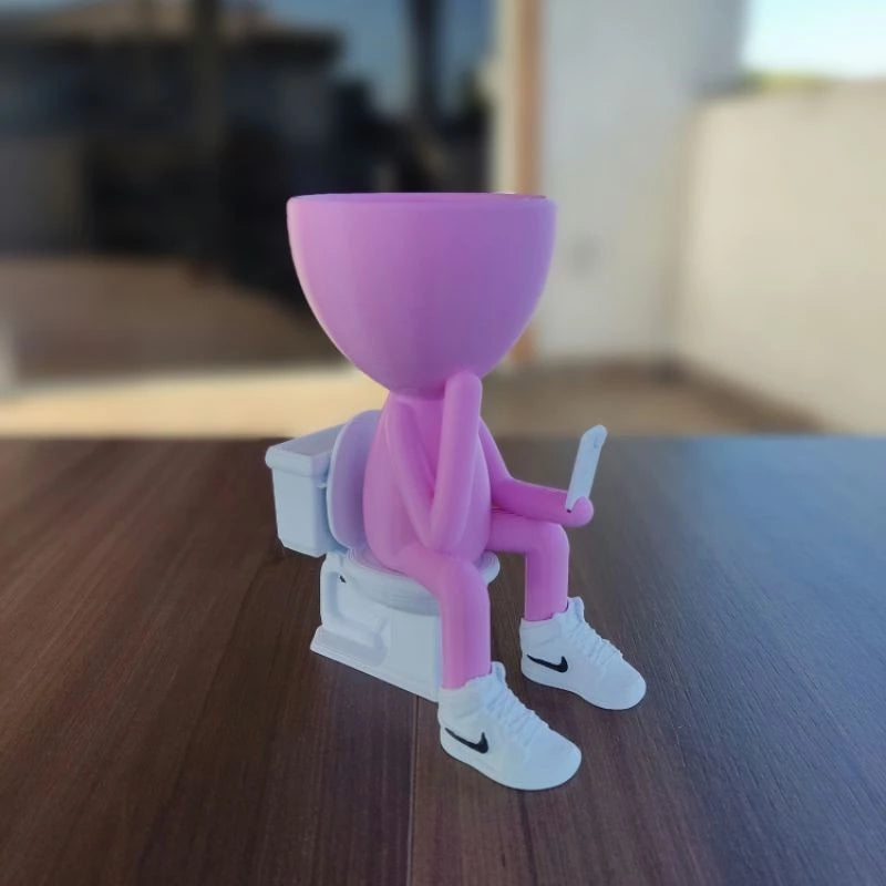 Vaso Decorativo Robert Plant no Banheiro com celular