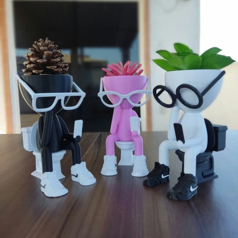 Vaso Decorativo Robert Plant no Banheiro com celular