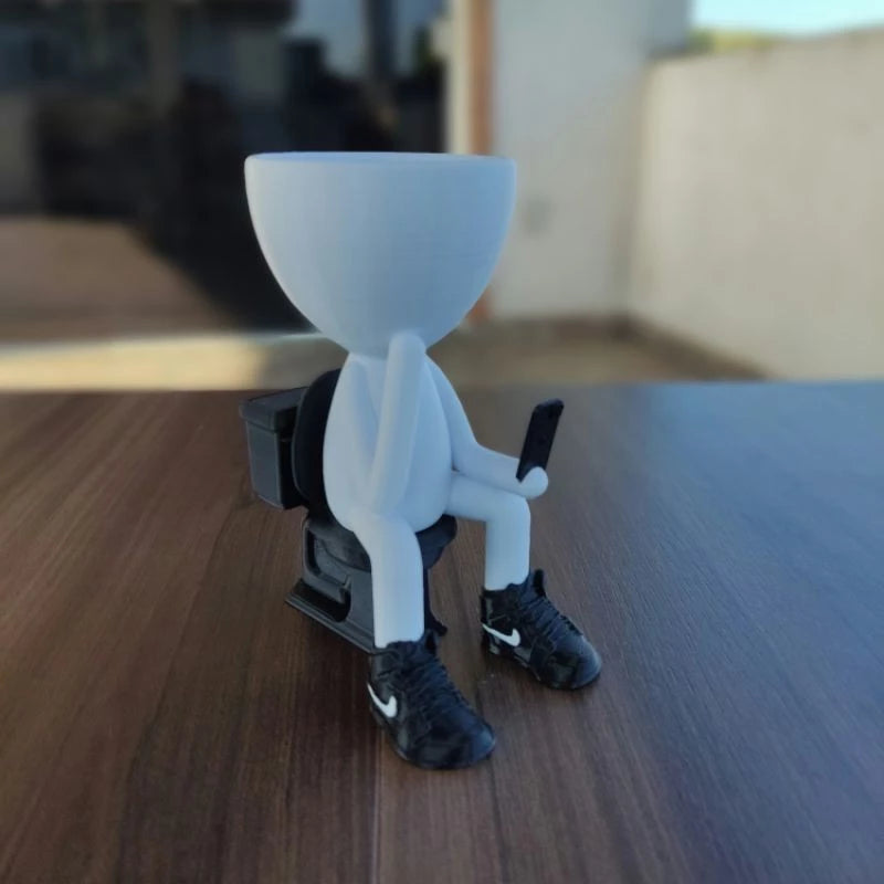 Vaso Decorativo Robert Plant no Banheiro com celular